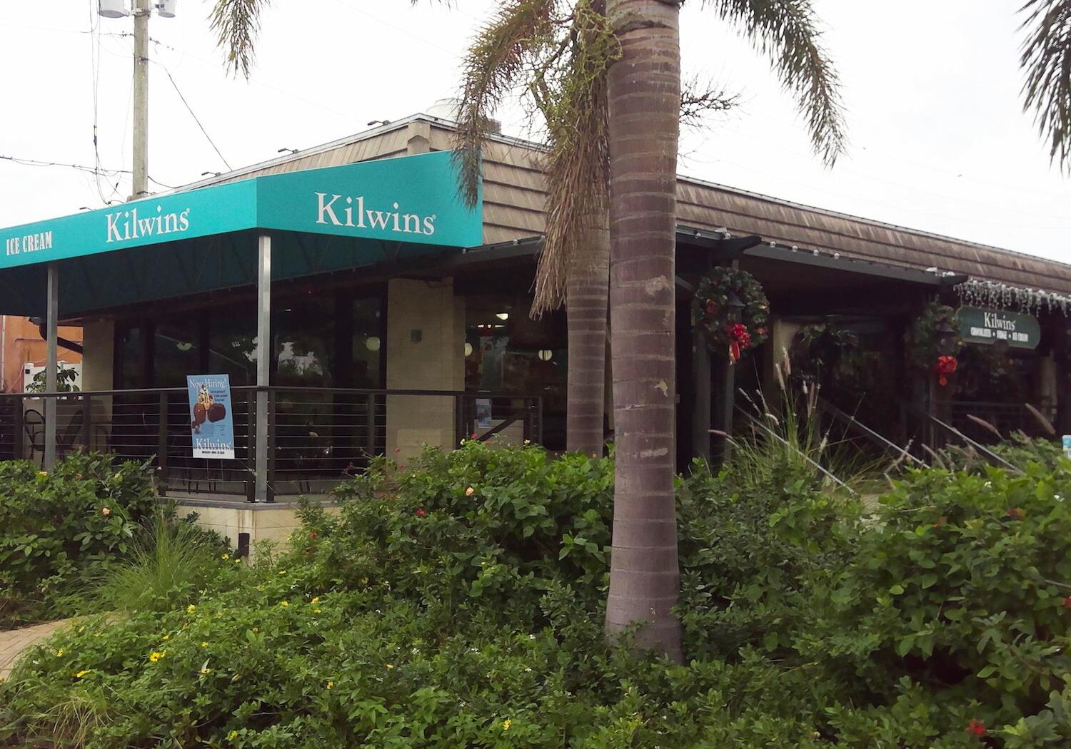 Kilwins ice cream shop exterior with palm trees